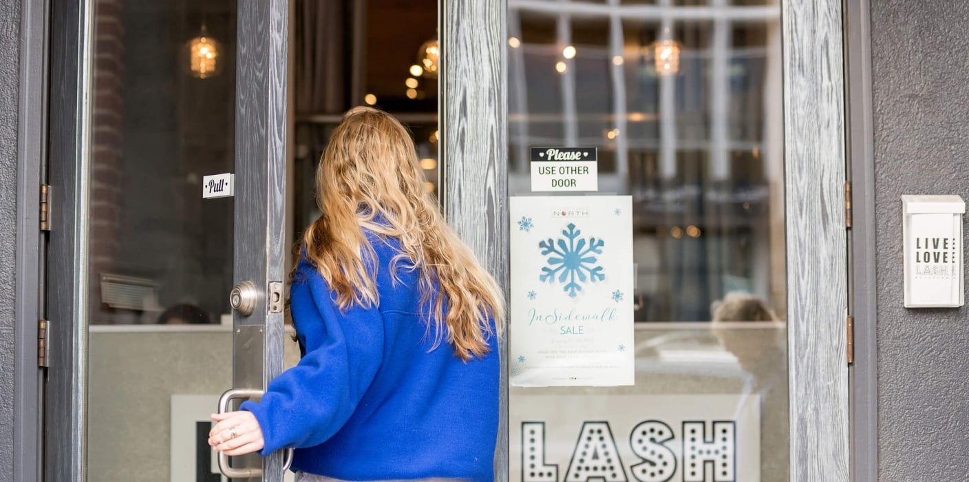 a women walking into a store