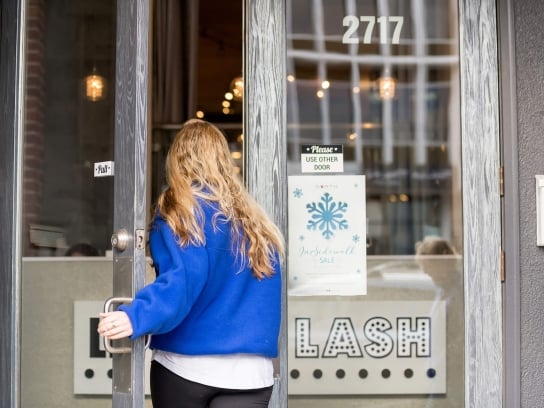a women walking into a store
