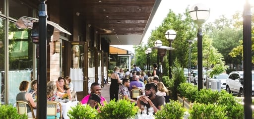 Groups of locals enjoying food outside
