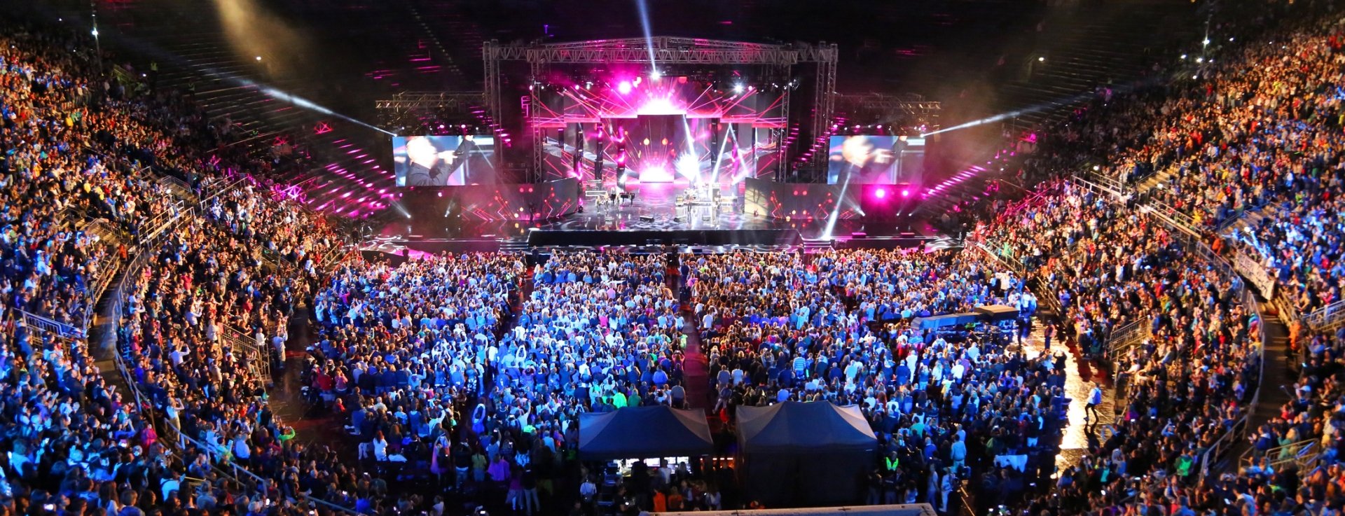 a large concert venue in italy packed to watch a performance