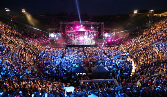 a large concert venue in italy packed to watch a performance