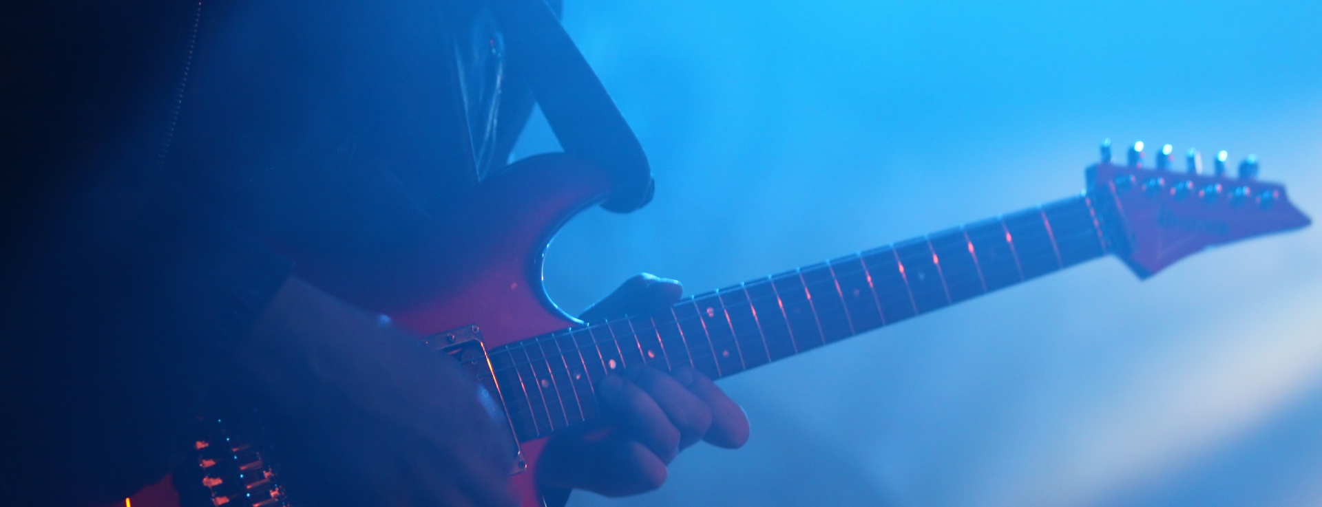 a person playing a guitar