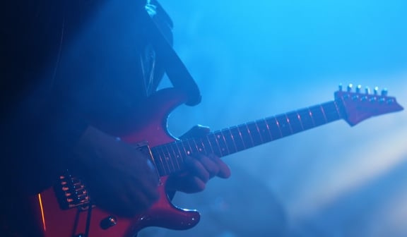 a person playing a guitar