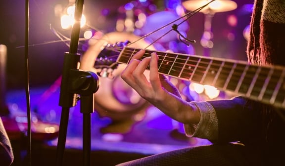 Someone playing a guitar