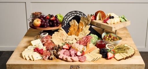 A charcuterie board sitting on a table at Hotel Clio