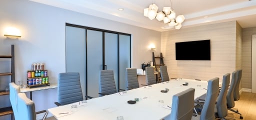 A large table with chairs perfect for meetings at Hotel Clio